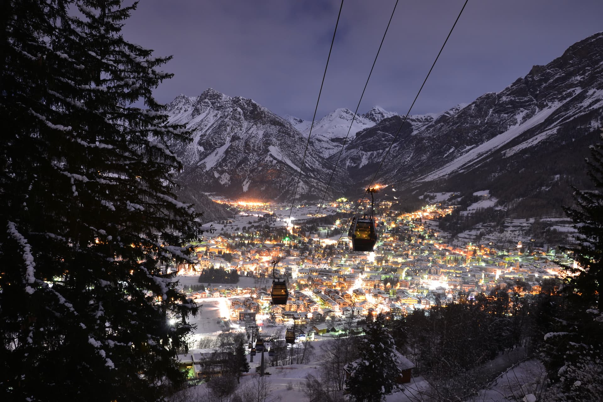 Bormio holiday ski resort lit up by lights at night