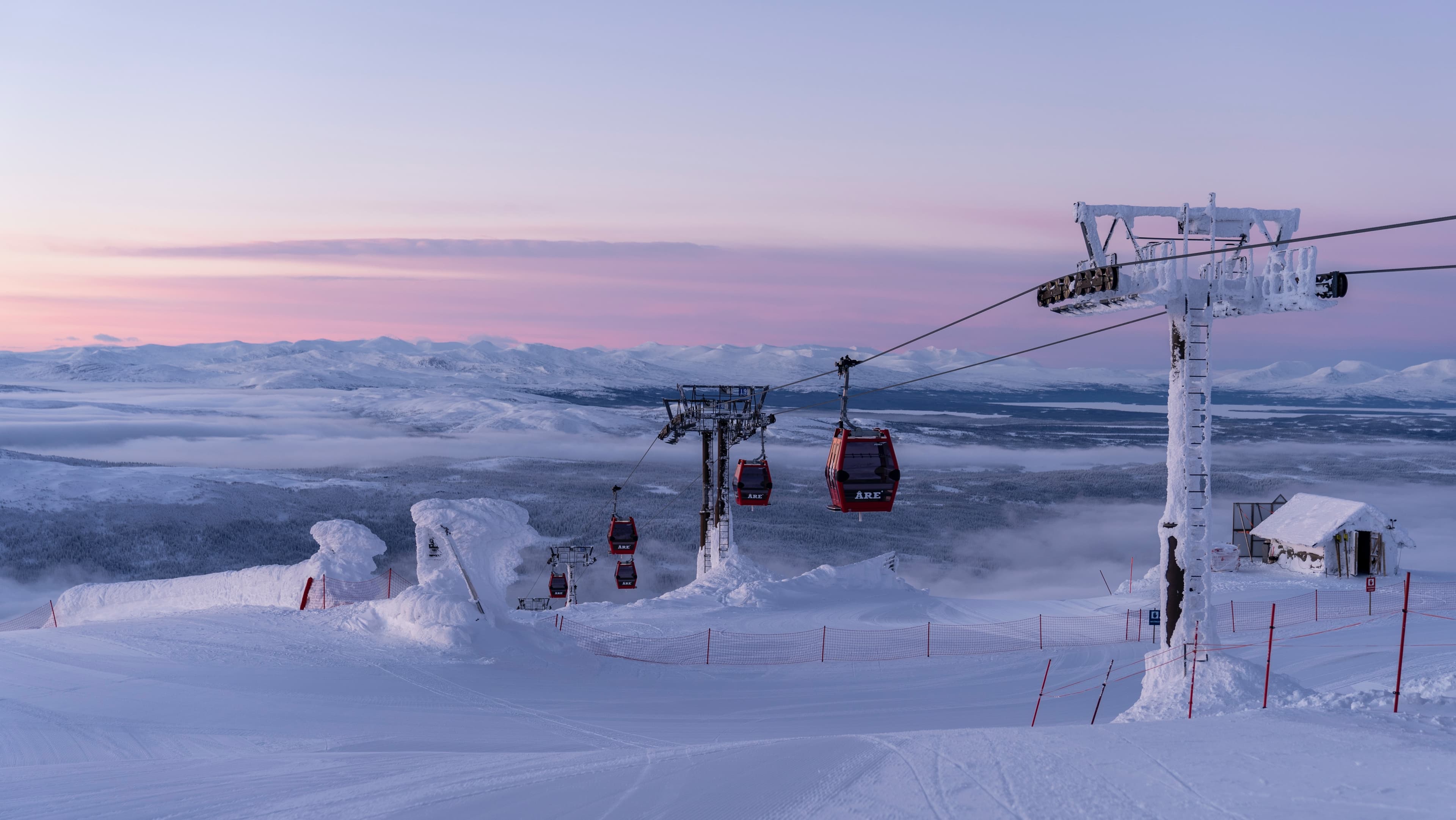 Gondolas at Are ski resort at sunset
